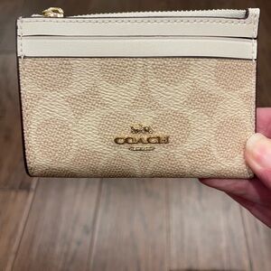 Coach Cream Wallet with Textured Design and Gold Logo